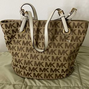 Beige Purse with dark brown MK logos.